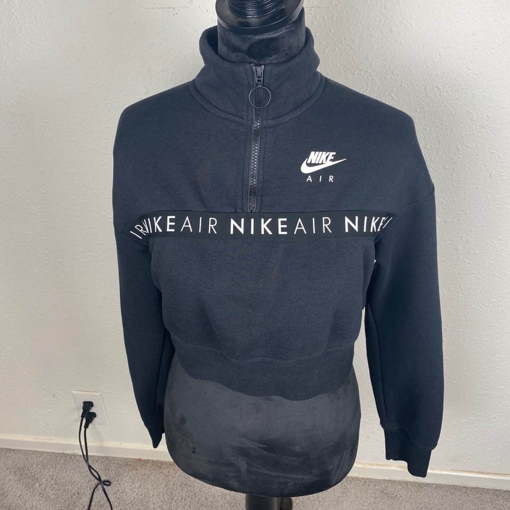 Small cropped Nike air shirt. Fits more like xs.